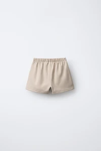 SOFT TOUCH SKORT WITH BOWS