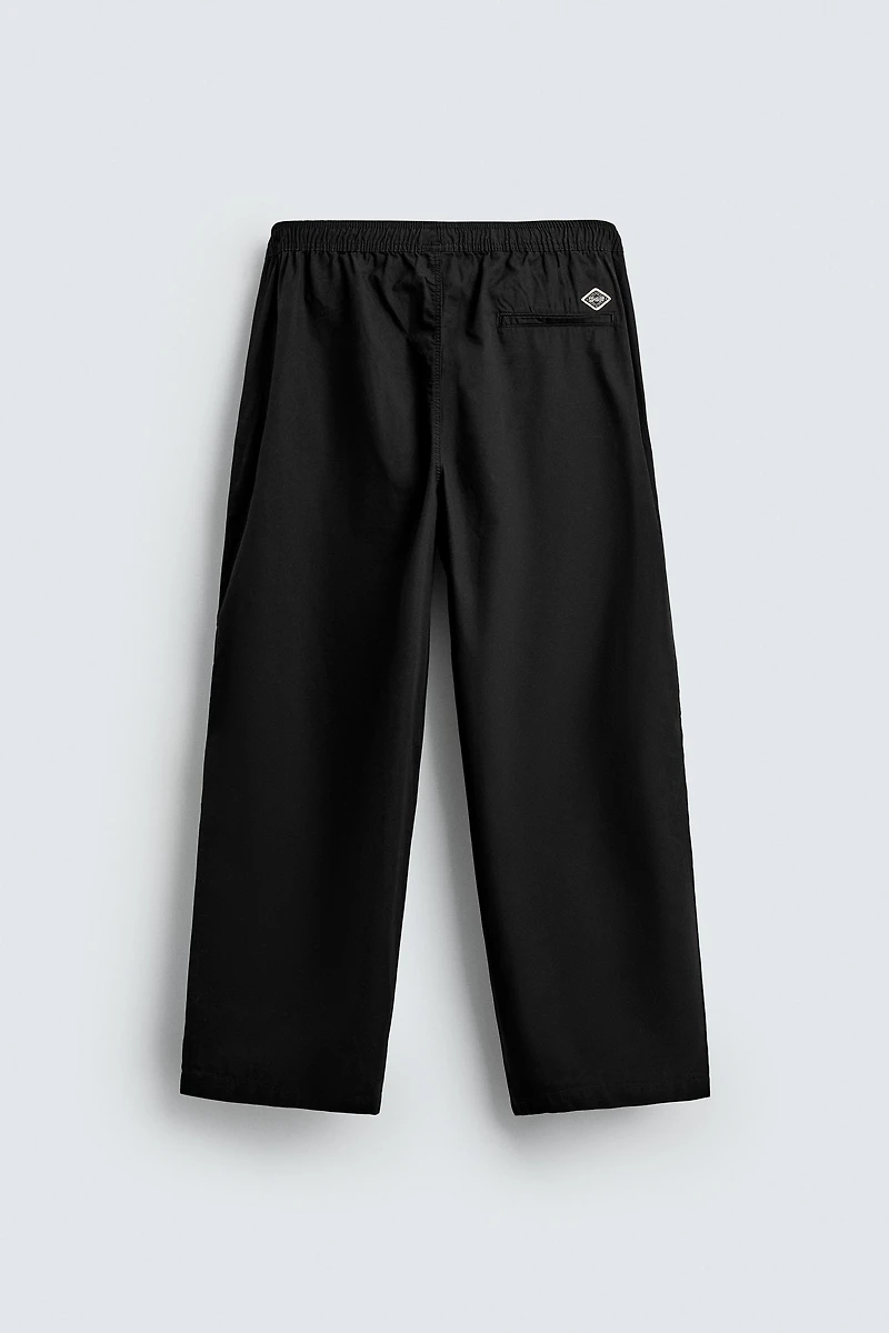 BALLOON FIT PLEATED PANTS