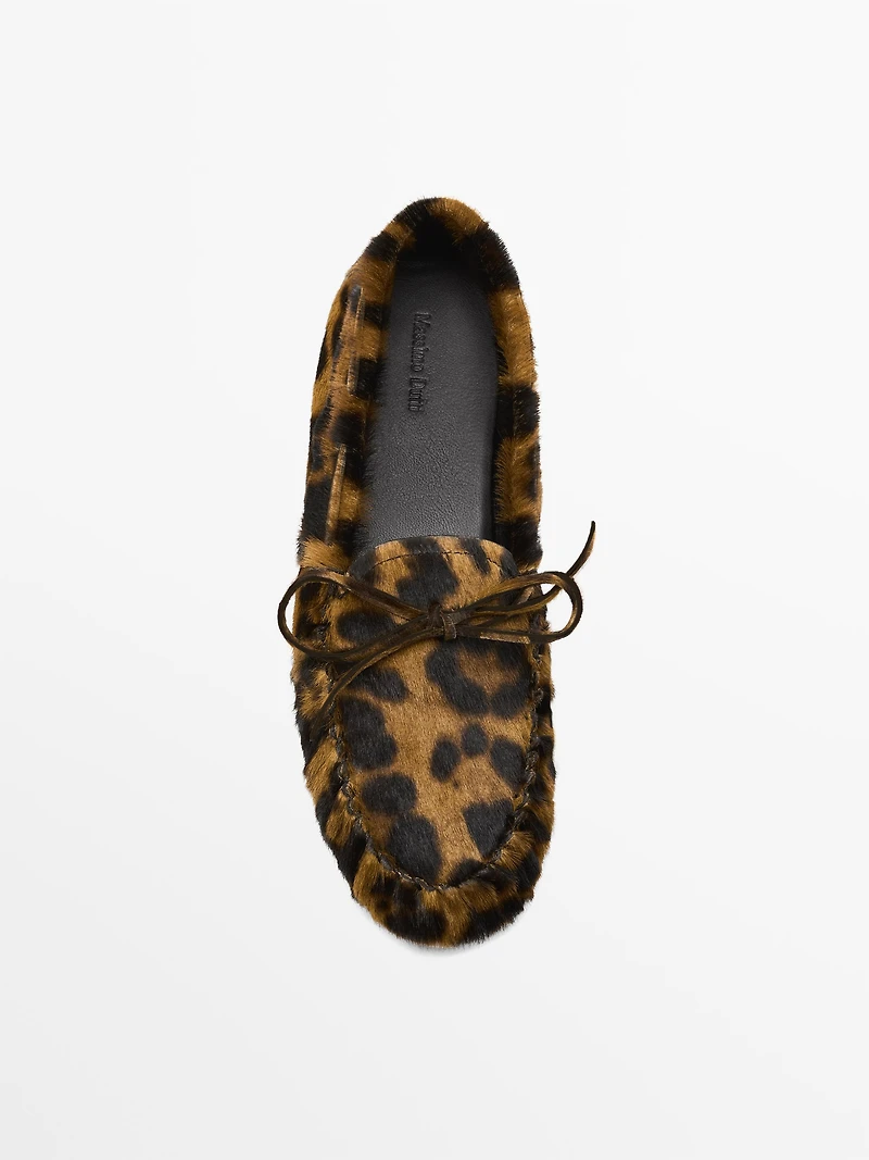 Animal print deck shoes
