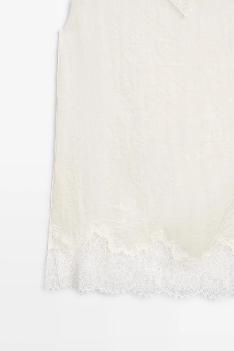 Asymmetric roll neck top with lace detail