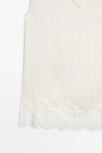 Asymmetric roll neck top with lace detail