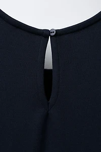 ROBE-SALOPETTE PLIS PLATS
