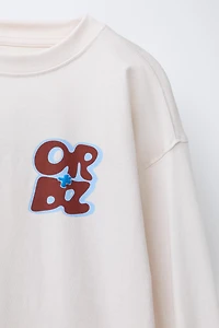 RAISED TEXT PRINT T-SHIRT