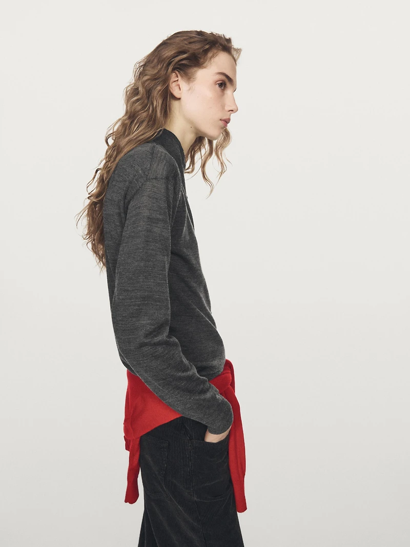 Mock turtleneck cardigan with covered buttons