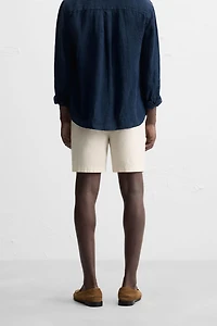 REGULAR FIT PLEATED BERMUDA SHORTS