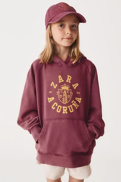 6- ANS/ SWEAT À CAPUCHE VARSITY 50TH ANNIVERSARY