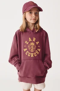 6- ANS/ SWEAT À CAPUCHE VARSITY 50TH ANNIVERSARY