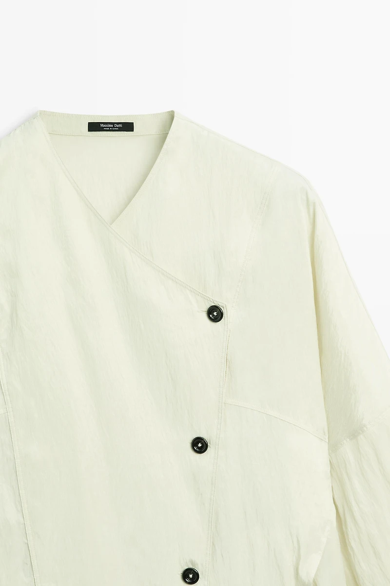 Fluid wrap shirt with button detail