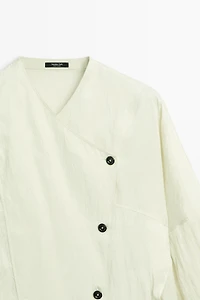 Fluid wrap shirt with button detail