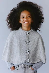 CAPE PONCHO WITH BOWS