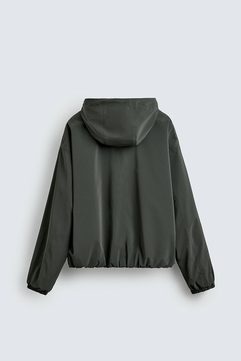 VESTE TECHNIQUE À CAPUCHE
