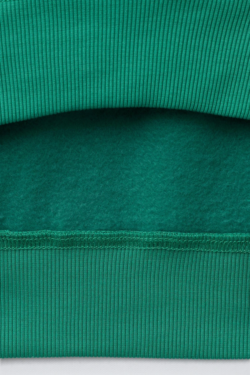 FLOCKED PRINT SWEATSHIRT