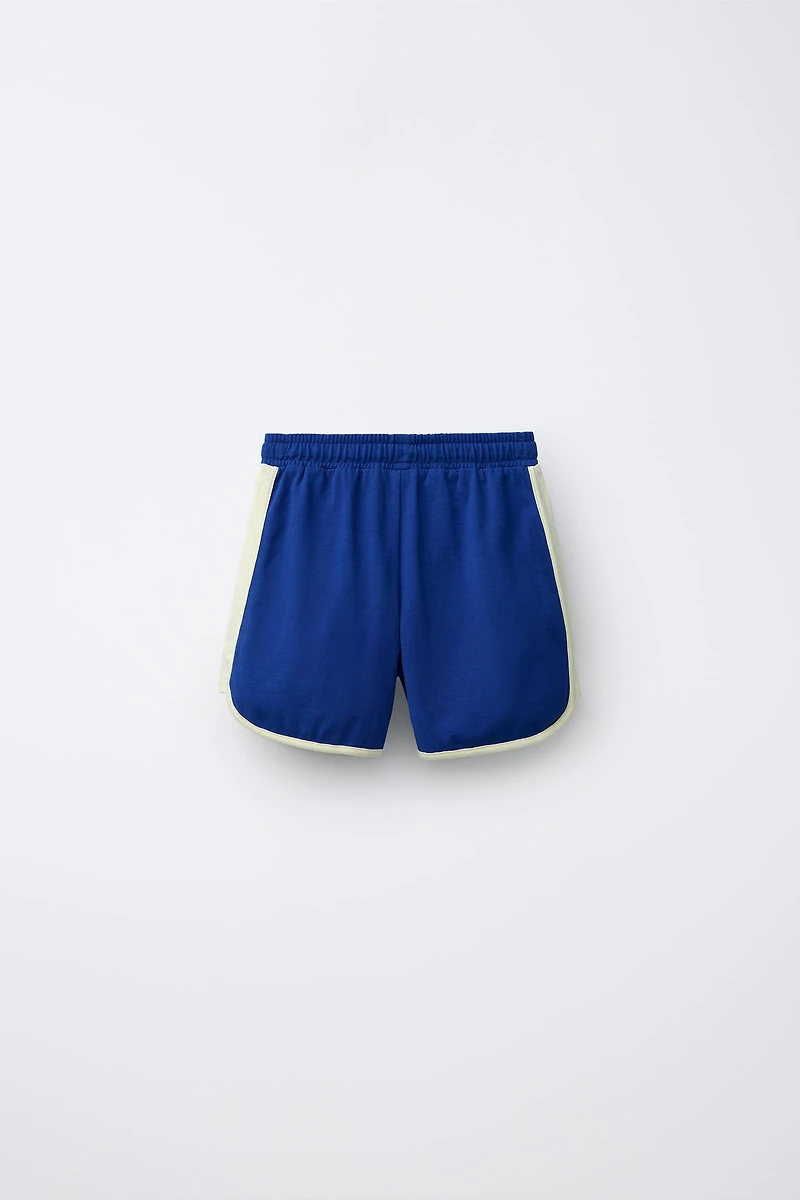 PLUSH SHORTS WITH CONTRAST PIPING