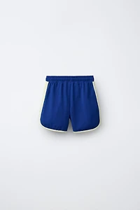 PLUSH SHORTS WITH CONTRAST PIPING