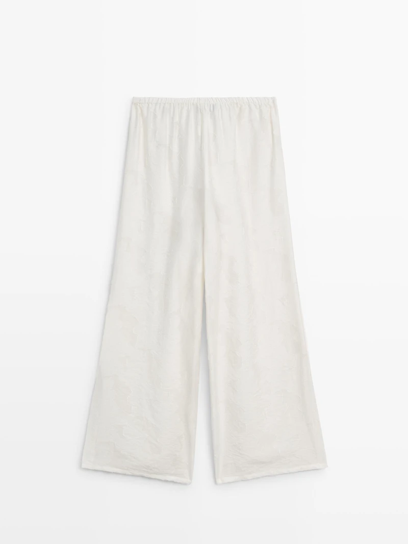 Flowing stretch trousers with fabric detail