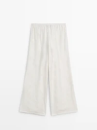 Flowing stretch trousers with fabric detail