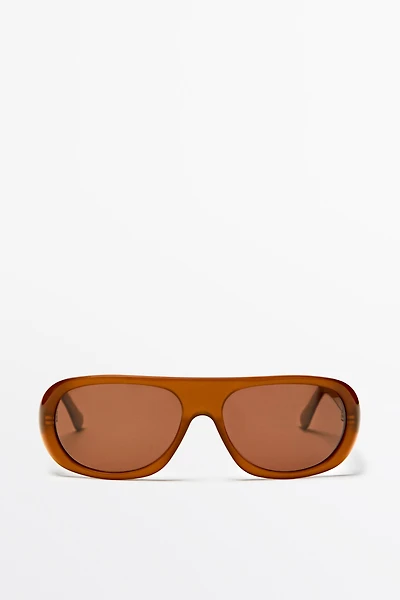 Lunettes de soleil enveloppantes
