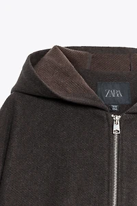 BLOUSON À CAPUCHE ET BAS ÉLASTIQUE