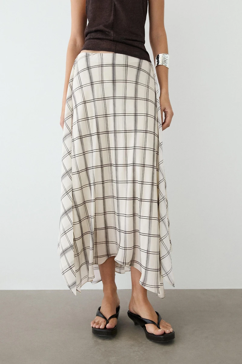 Jupe midi asymétrique à détail carreaux