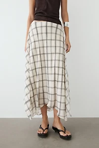 Jupe midi asymétrique à détail carreaux