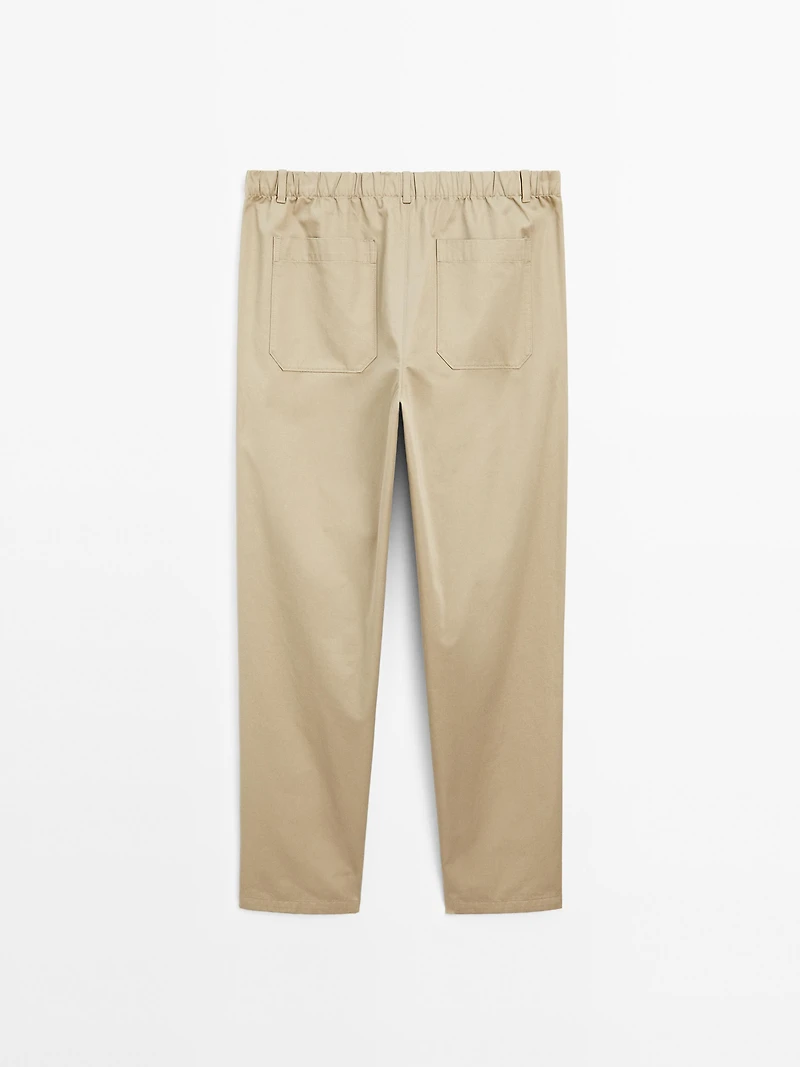 Trousers with patch pocket