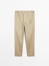 Trousers with patch pocket