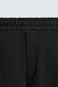 BALLOON PANTS WITH TWISTED SEAMS