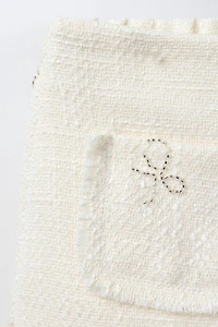 SHINY BOW TEXTURED SKIRT