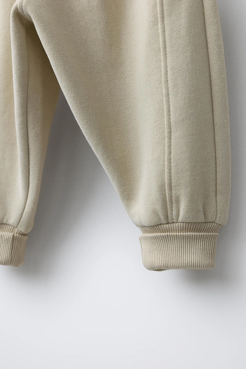 FLOCKED LOGO JOGGER PANTS