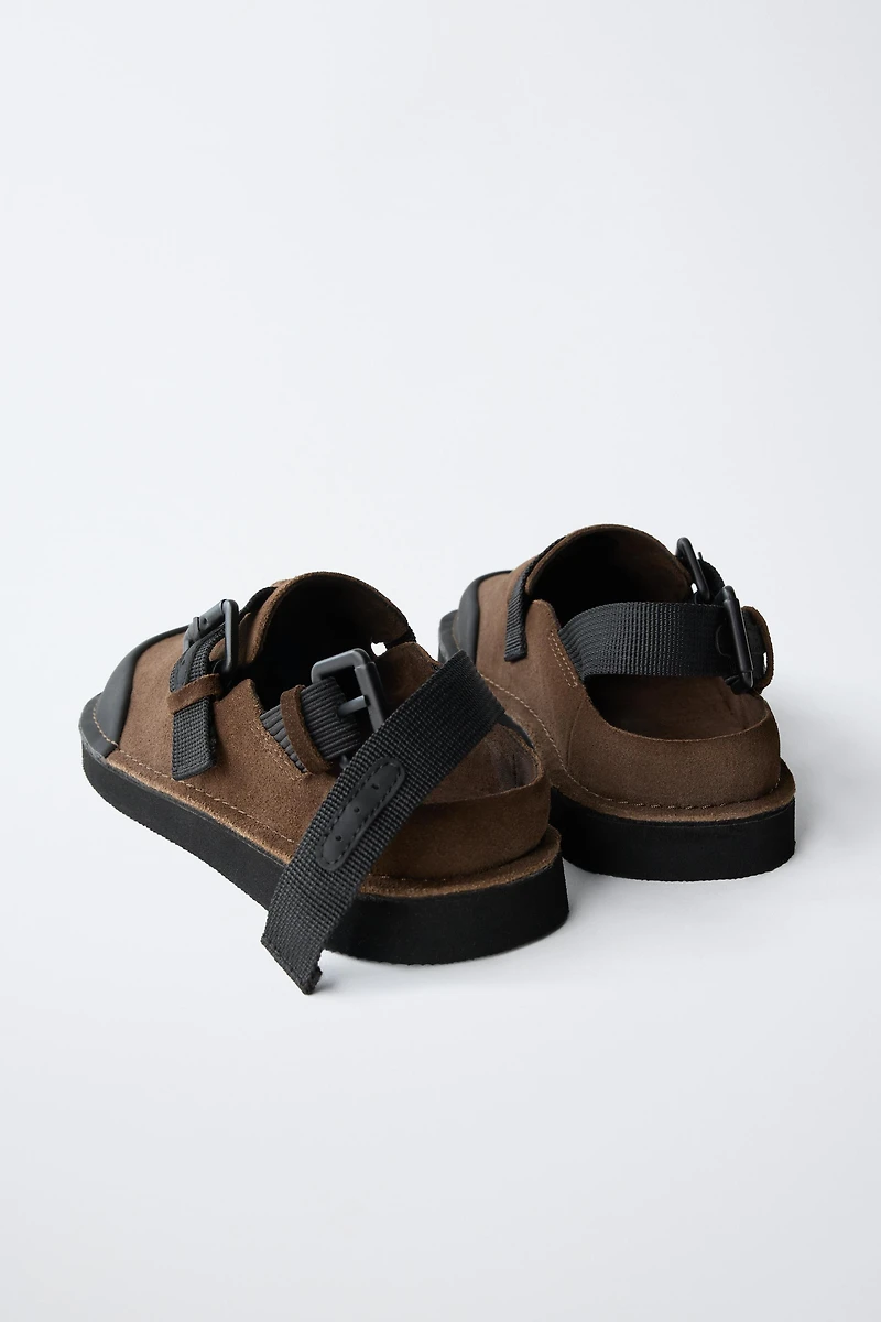 BUCKLED CLOGS
