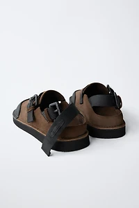 BUCKLED CLOGS