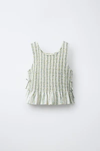 ELASTICIZED TIE TOP