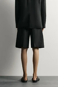 TEXTURED PLEATED SUIT SHORTS