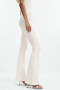 INTERLOCK FLARE JUMPSUIT