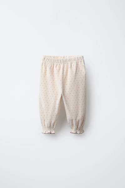 PANTALON BAGGY EN VELOURS À POIS