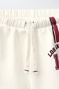 CONTRAST PIPING TEXT SHORTS