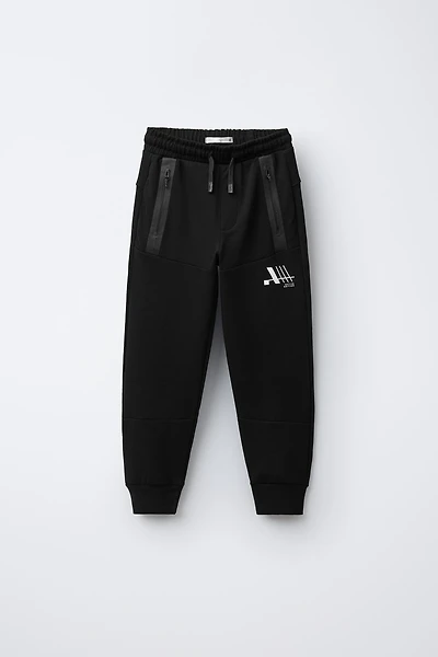 SPORTY INTERLOCK JOGGERS