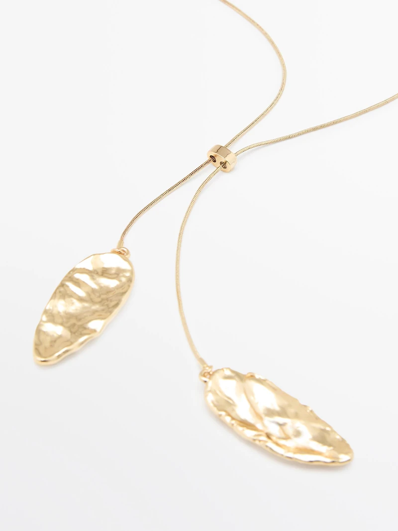 Adjustable necklace with textured pieces
