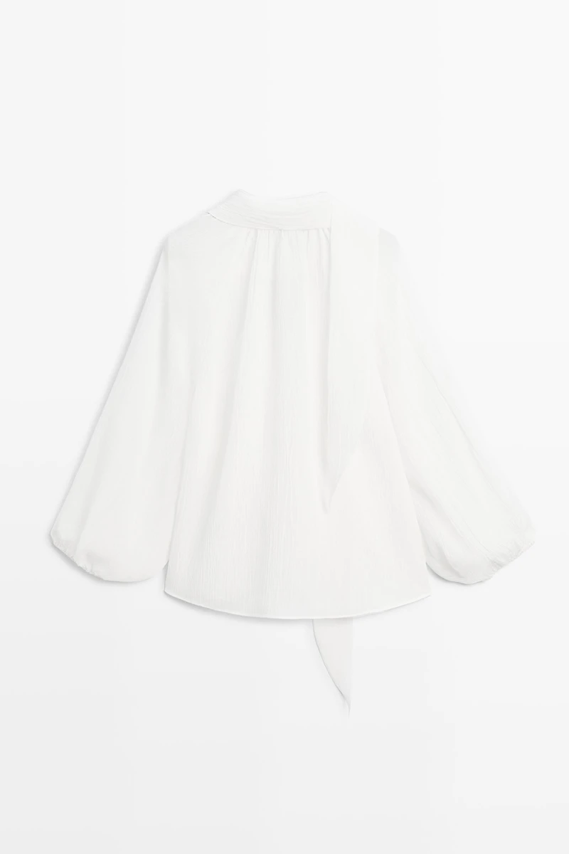 Flowing V-neck blouse with tie