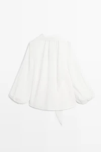 Flowing V-neck blouse with tie