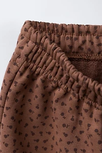 PANTALON EN MOLLETON JUPE-CULOTTE IMPRIMÉ DENTELLE