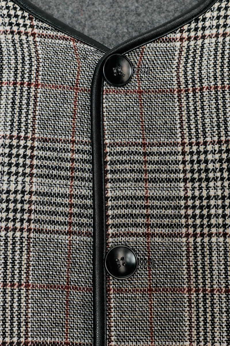 VESTE RÉVERSIBLE À LISERÉS EN MATIÈRE SYNTHÉTIQUE