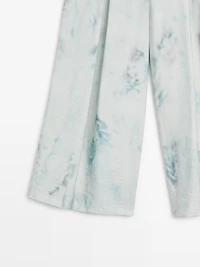 Printed trousers with pleat details