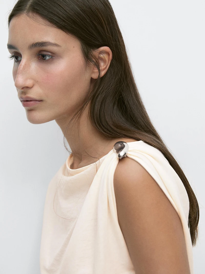 Asymmetric top with shoulder appliqué