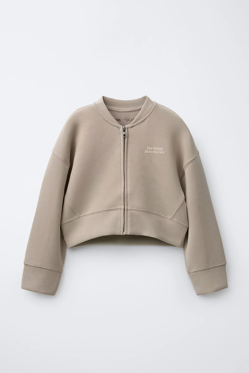 RAISED TEXT SWEATSHIRT