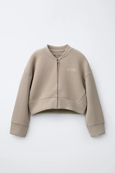 RAISED TEXT SWEATSHIRT