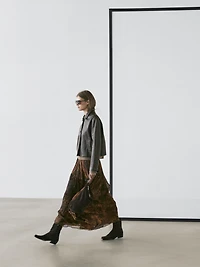 Flowing asymmetric midi skirt