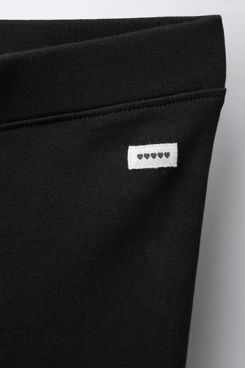 INTERLOCK FLARE LEGGINGS WITH LABEL DETAIL