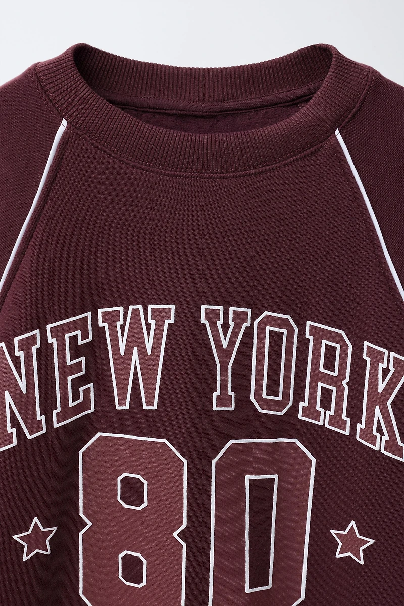 RAGLAN SLEEVE SWEATSHIRT WITH TEXT AND NUMBER