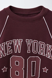 RAGLAN SLEEVE SWEATSHIRT WITH TEXT AND NUMBER